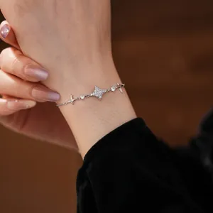 Sparkling zircon starburst pendant bracelet with adjustable silver-tone sliding chain