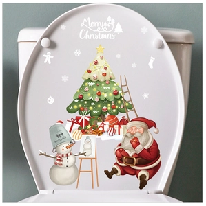 Detailed view of festive Santa and snowman Christmas decals applied on a white toilet lid