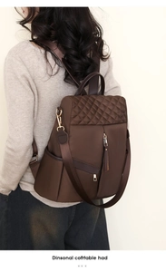 Rear view of brown nylon anti-theft backpack featuring quilted diamond pattern stitching
