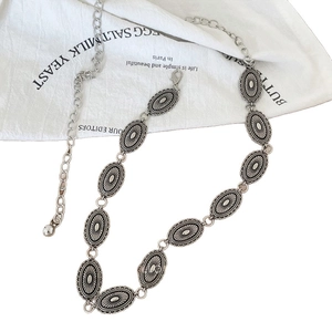 Vintage silver metal waist chain belt with embossed oval links and adjustable lobster clasp