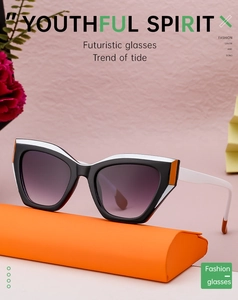 Cat-eye sunglasses with black-and-white frame on orange case with purple gradient lenses