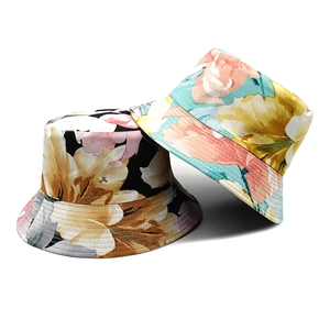 Double-sided floral bucket hat for women in black and light blue tropical prints