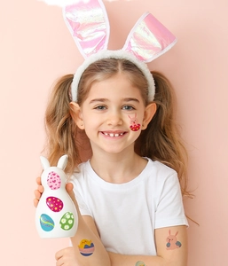 Tatouages temporaires de Pâques pour enfants avec motifs lapins et œufs sur le visage