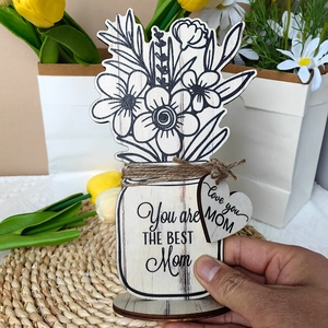 Detail of wooden Mason jar plaque with Love you MOM heart tag and floral design