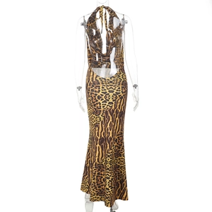 Detail of backless leopard print maxi dress showing deep open back and slim fit design