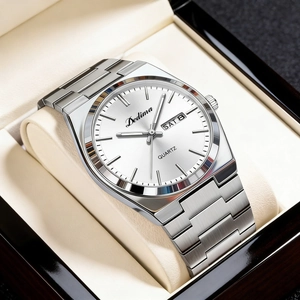 Detail of silver steel watch featuring white dial with dual day-date calendar display