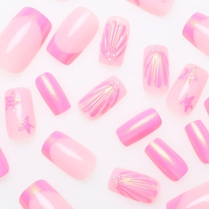 Pearlescent mermaid shell press-on nails with 3D pearls and ocean theme designs
