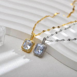 Macro shot of silver and gold necklaces with square cubic zirconia and micro-pave setting