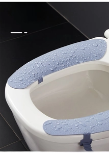 Macro shot of waterproof light blue silicone toilet pads with hydrophobic water droplets