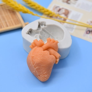 DIY silicone mold for human heart shaped cakes and chocolates on a blue background