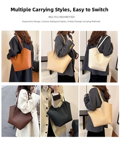 Borse tote minimaliste in pelle in vari colori mostrate indossate da una modella