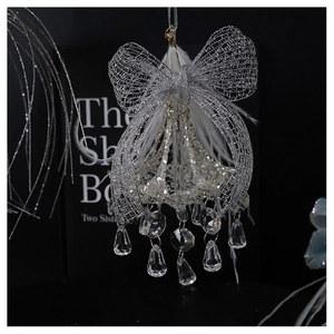 Close-up of crystal chandelier ornament with silver glitter, bow, and white feathers