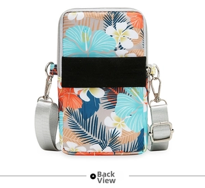 Detail view of the back of floral oxford fabric crossbody phone bag with elastic band
