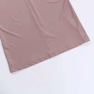 Detail shot of the hemline stitching on this slim-fit mauve pink bodycon dress