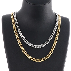 6.5mm gold and silver Cuban link chains displayed on a professional black bust mannequin