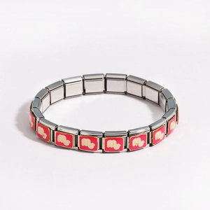 Detail of Italian modular stainless steel bracelet with pink enamel charms and stretch links