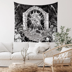 Detail of bohemian skull tapestry with dark art illustration over a white sofa