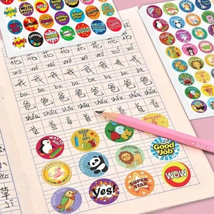Colorful cartoon animal reward stickers with positive English words on a notebook