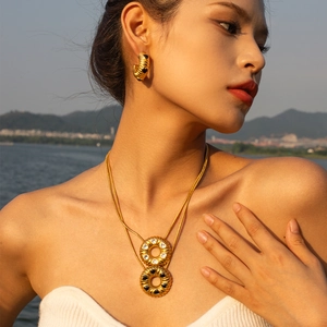 Vintage 18k gold plated stainless steel jewelry set with heart pendants on model