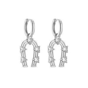 Macro shot of silver horseshoe earrings with five inlaid heart-shaped zircon stones