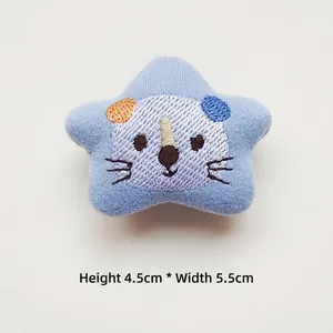 Close-up of blue plush star patch with animal embroidery measuring 4.5cm by 5.5cm