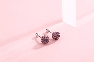 Detail of S925 silver screw stud earrings with sparkling purple crystal pave balls