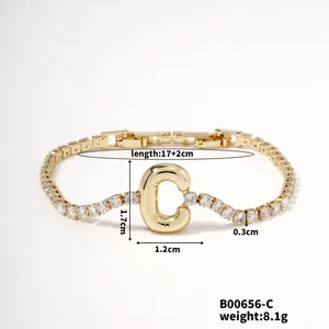 Detail view of a gold letter C bracelet with cubic zirconia chain and dimensions