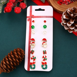 Detailed set of six Christmas themed stud earrings featuring Santa Claus and gift box designs