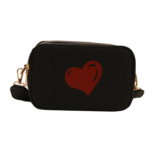 Minimalist black crossbody bag with red heart pattern and golden zipper detail