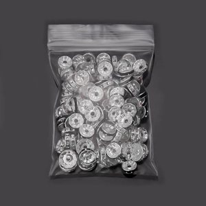 Macro shot of silver rhinestone spacer beads in bulk for DIY bracelet jewelry making