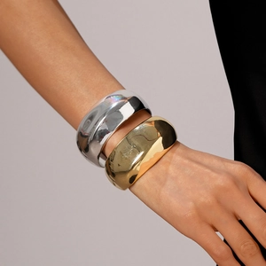 Minimalist thick metal cuff bracelets in polished gold and silver finishes for women