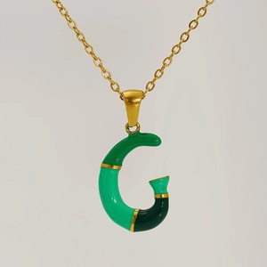 Golden necklace featuring a green gradient enamel letter G pendant in bamboo style