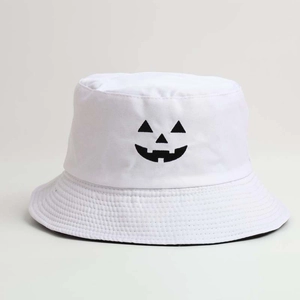 Detail of embroidered Halloween pumpkin face on white cotton bucket hat with clean stitching