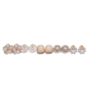 10-piece gold floral earring set with rhinestones, faux pearls, and cream resin charms