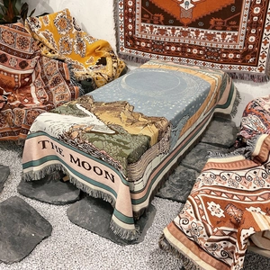 Bohemian woven camping blanket with moon and mountain tarot design and fringe edges