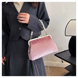 Pink velvet handbag with pearl handle and rhinestone diamond lattice detail