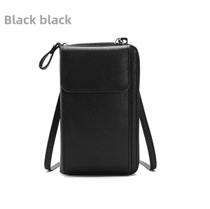 Detail view of black lychee-textured leather mobile phone crossbody bag with front magnetic flap
