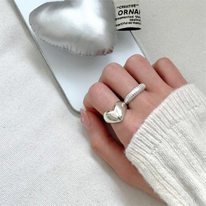 Minimalist 925 sterling silver heart ring with polished finish and spiral textured band