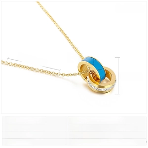 Detail view of double ring pendant with turquoise, white rhinestones, and 450mm chain