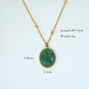 Detail view of 14K gold stainless steel necklace with green stone and size dimensions