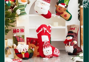 Detailed close-up of large knitted Christmas stockings with Santa and snowman patterns