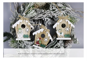 Detail of wooden Christmas ornaments featuring Santa, snowman, and reindeer icons