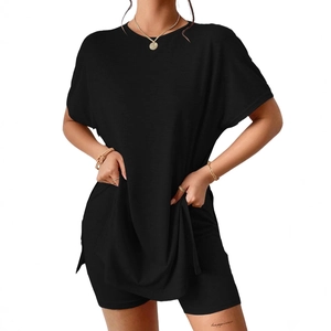 Women's black casual two-piece set with oversized crewneck t-shirt and cycling shorts