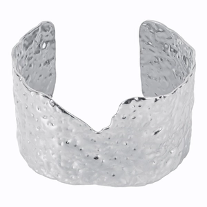 Detailed view of wide hammered texture cuff bracelet with irregular wavy silver edges