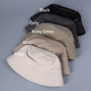 Washed cotton bucket hats in black, grey, khaki, and beige displayed on a dark surface