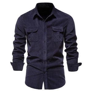 Detail of navy corduroy long sleeve shirt showing chest pockets and ribbed texture