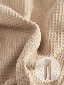 Macro texture of khaki waffle knit fabric for men's casual drawstring joggers