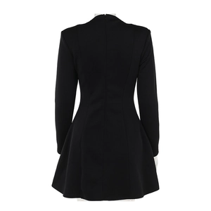Detail view of the slim fit black dress back with hidden zipper and waist cutouts