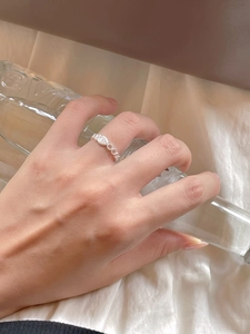Close-up of minimalist S925 sterling silver ring with marquise zircon on model hand