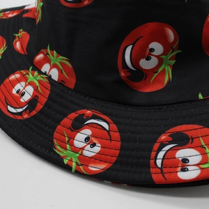 Close-up of black bucket hat with cartoon tomato prints and reinforced brim stitching